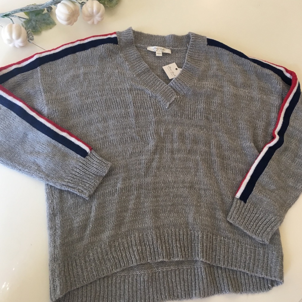 Gray V-neck sweater with stripes on sleeves.